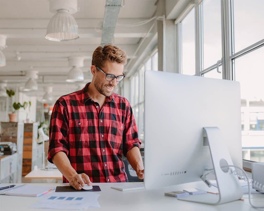 Image of man uploading files to Casey's online proofing portal