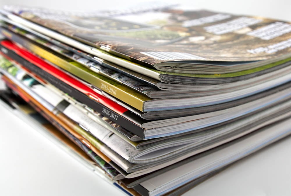Stack of publications printed by Casey Printing
