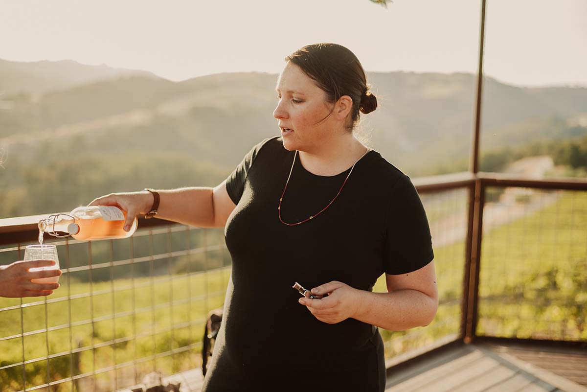 Maggie pouring wine